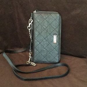 Miche zippered black phone wallet.